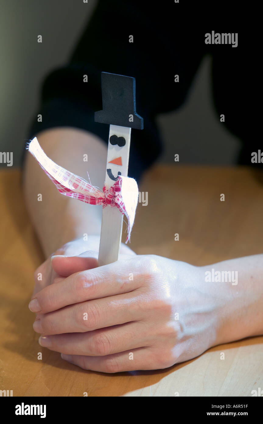 A cute little hand crafted and home made holiday snowman made from a