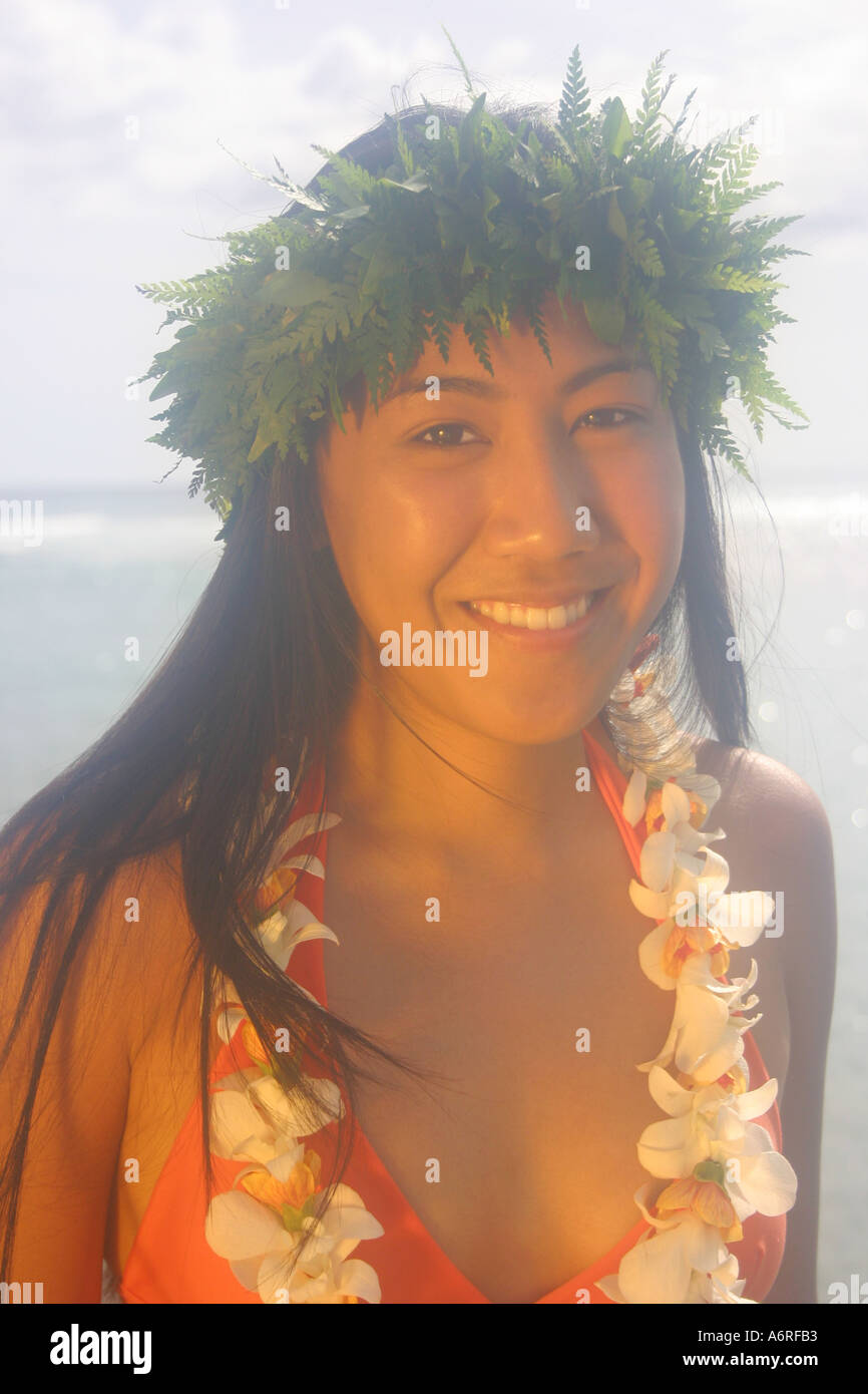 Young Hawaiian woman with lei smiling Hawaii Stock Photo