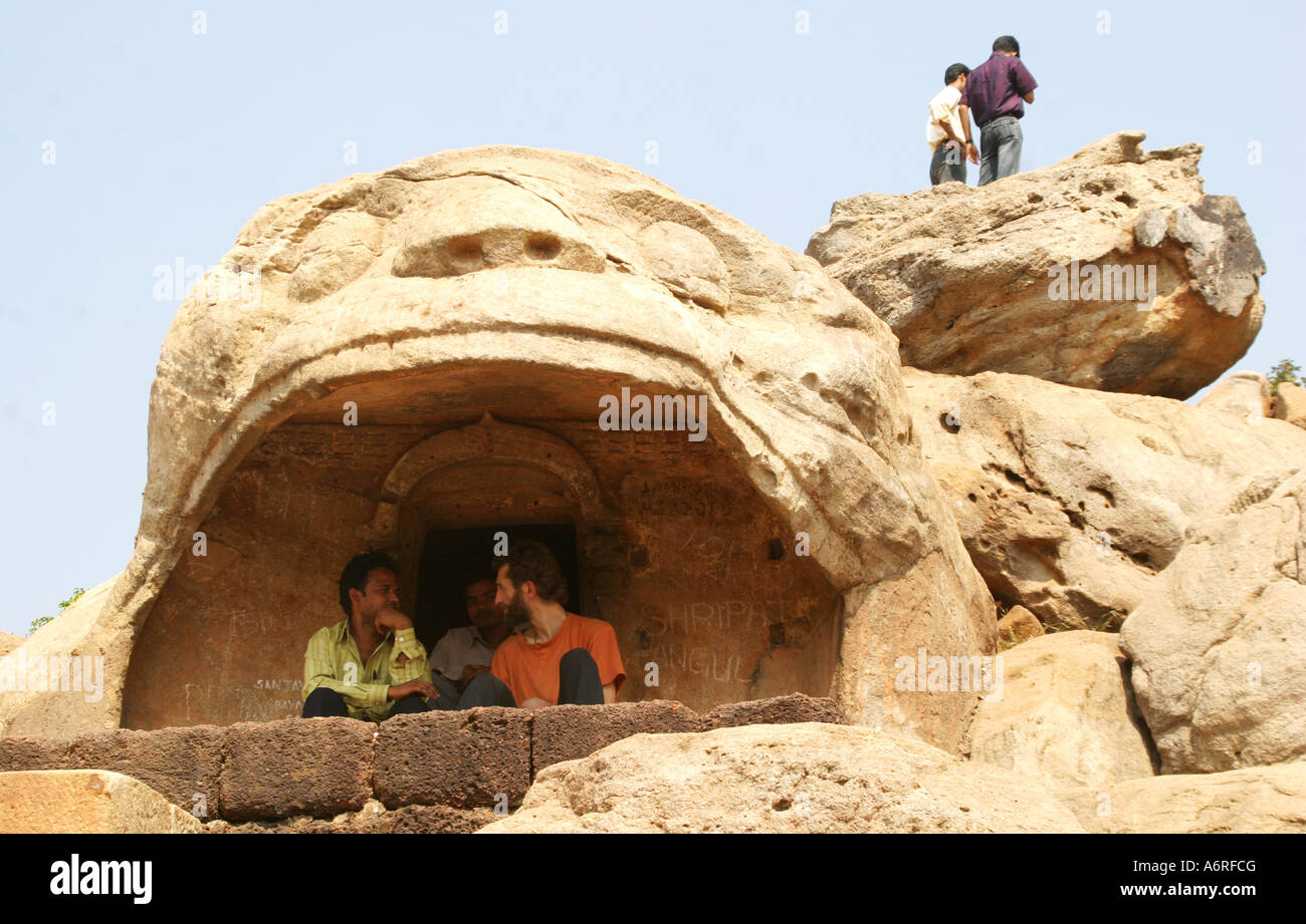 .Sightseers In the leopard's mouth Cave,Bagh Gumpha,at the famous Udayagiri Caves near Bhubaneswar in Orissa,India Stock Photo