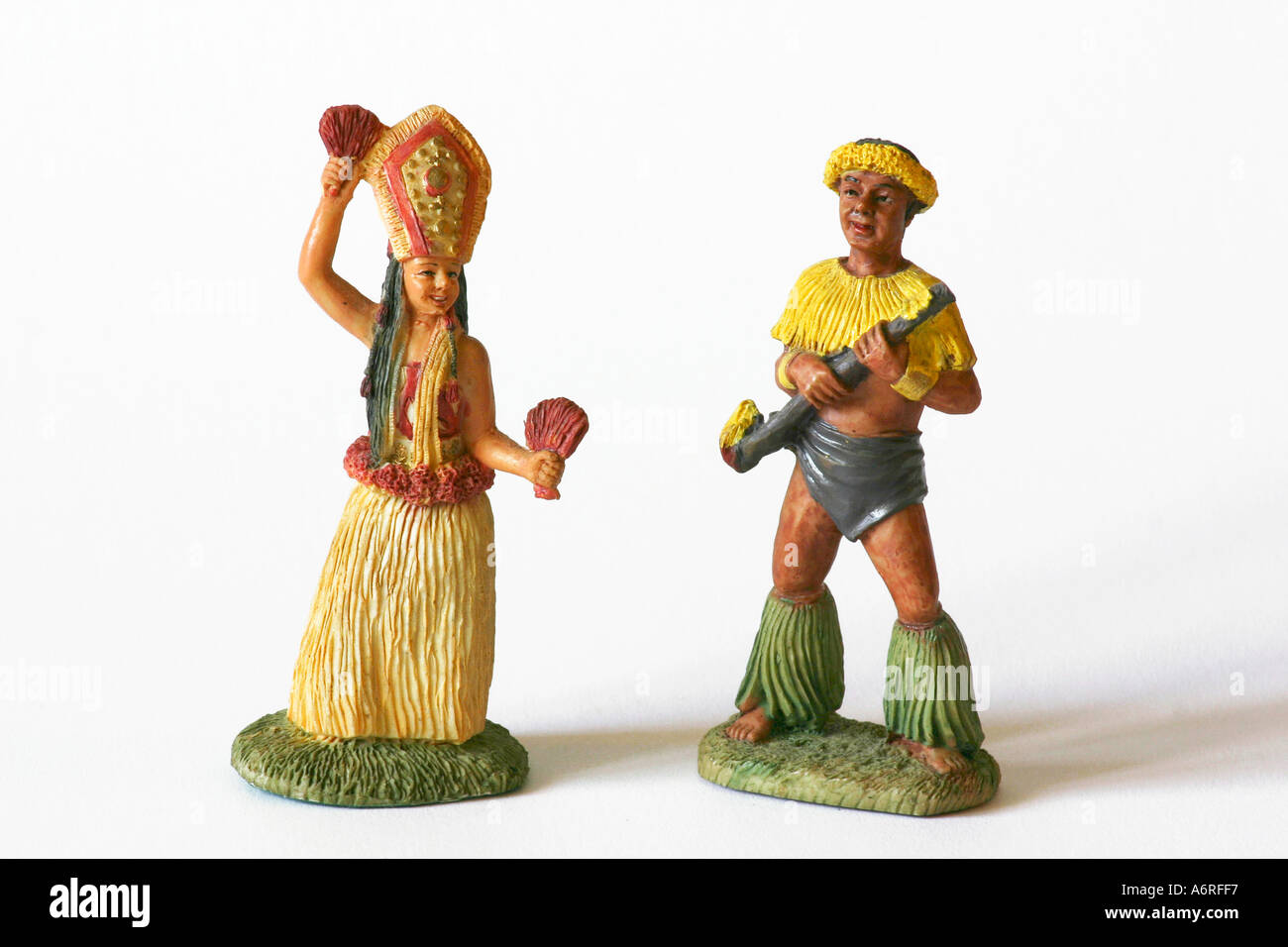 Male and female ceramic Hawaiian figurine statues or dolls in traditional native clothing and hula skirt Stock Photo