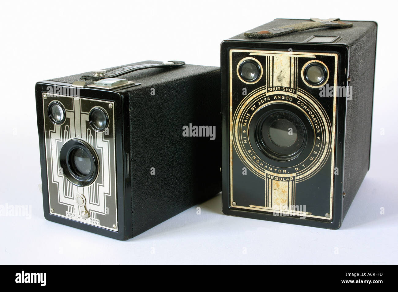 Two vintage antique box brownie cameras against white studio background Stock Photo Alamy