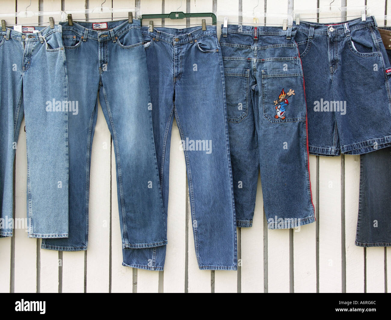 Pants hanging on Wall Stock Photo