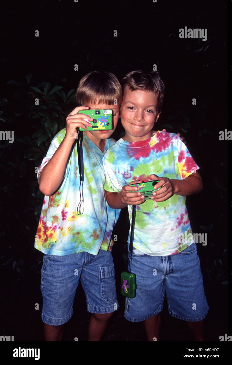 Two young boys taking pictures Stock Photo