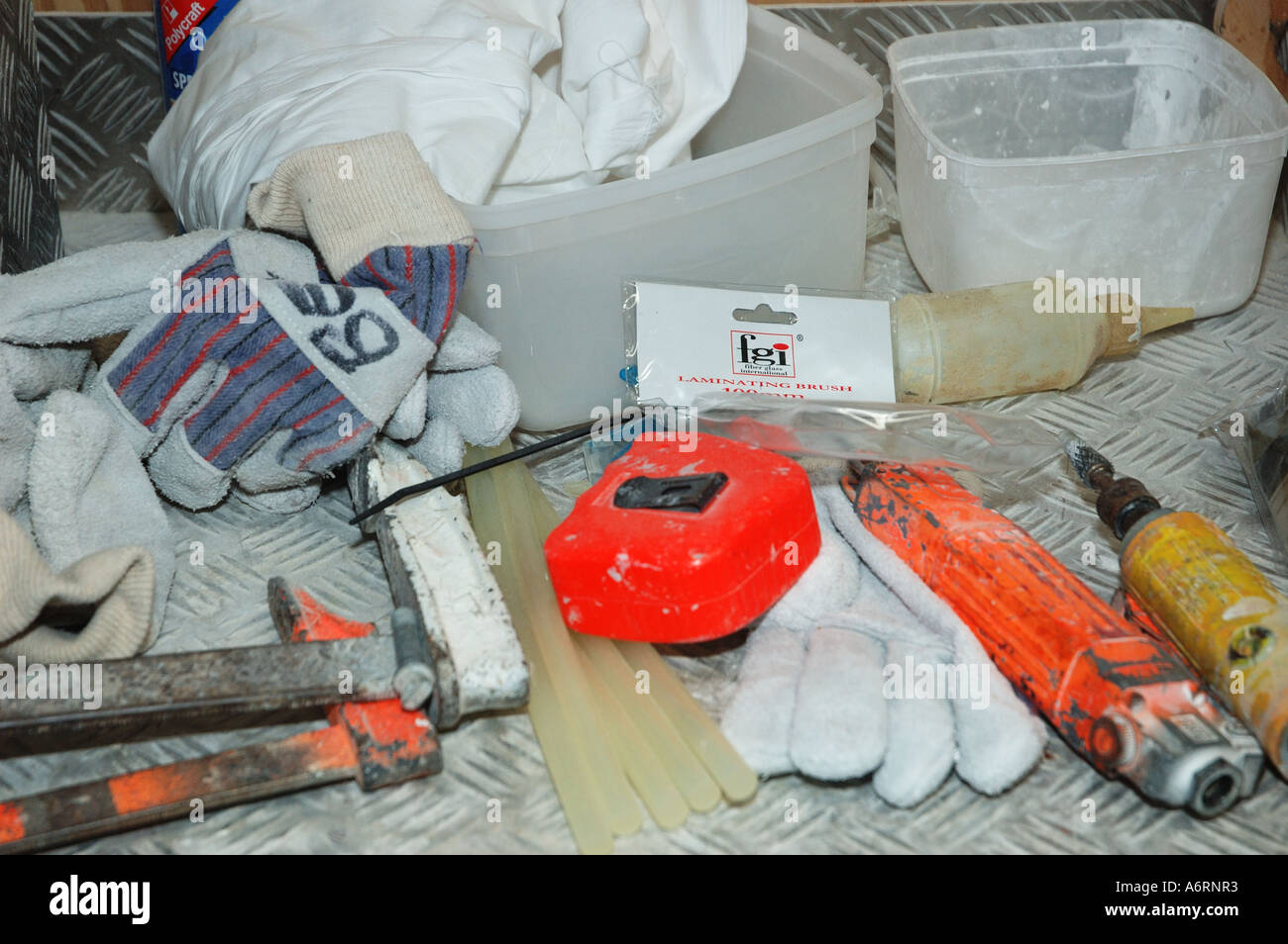 tools and gloves on workbench Stock Photo