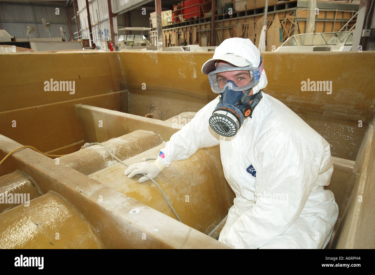 boat builder cleaning mould ready for gel coating Stock Photo