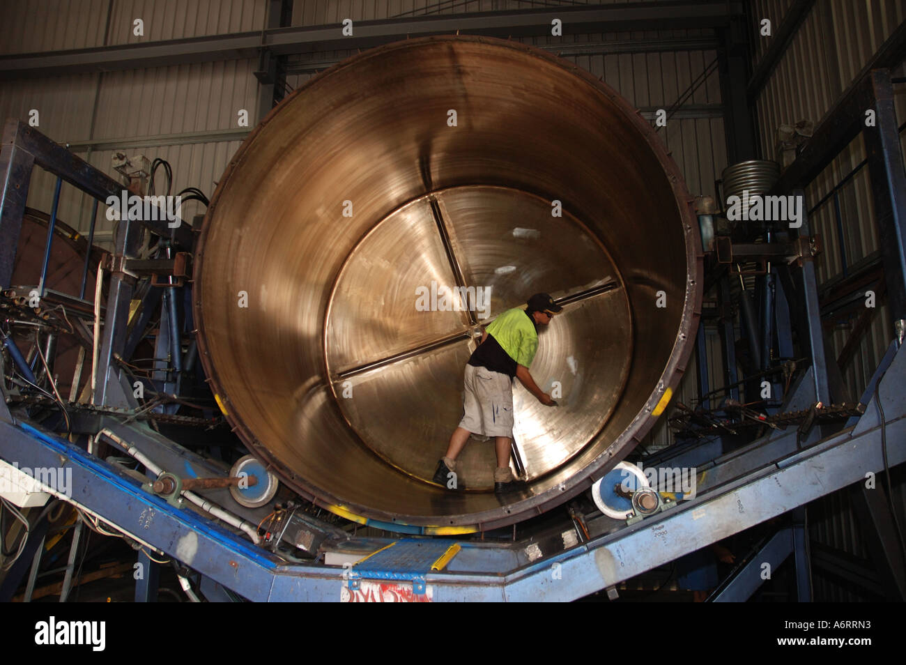 worker cleans mould for rainwater tank Stock Photo