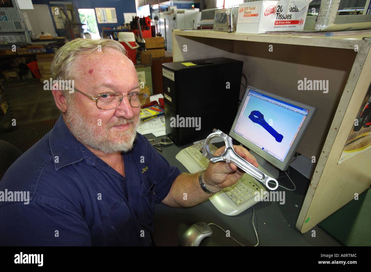 mature worker in metal workshop Stock Photo