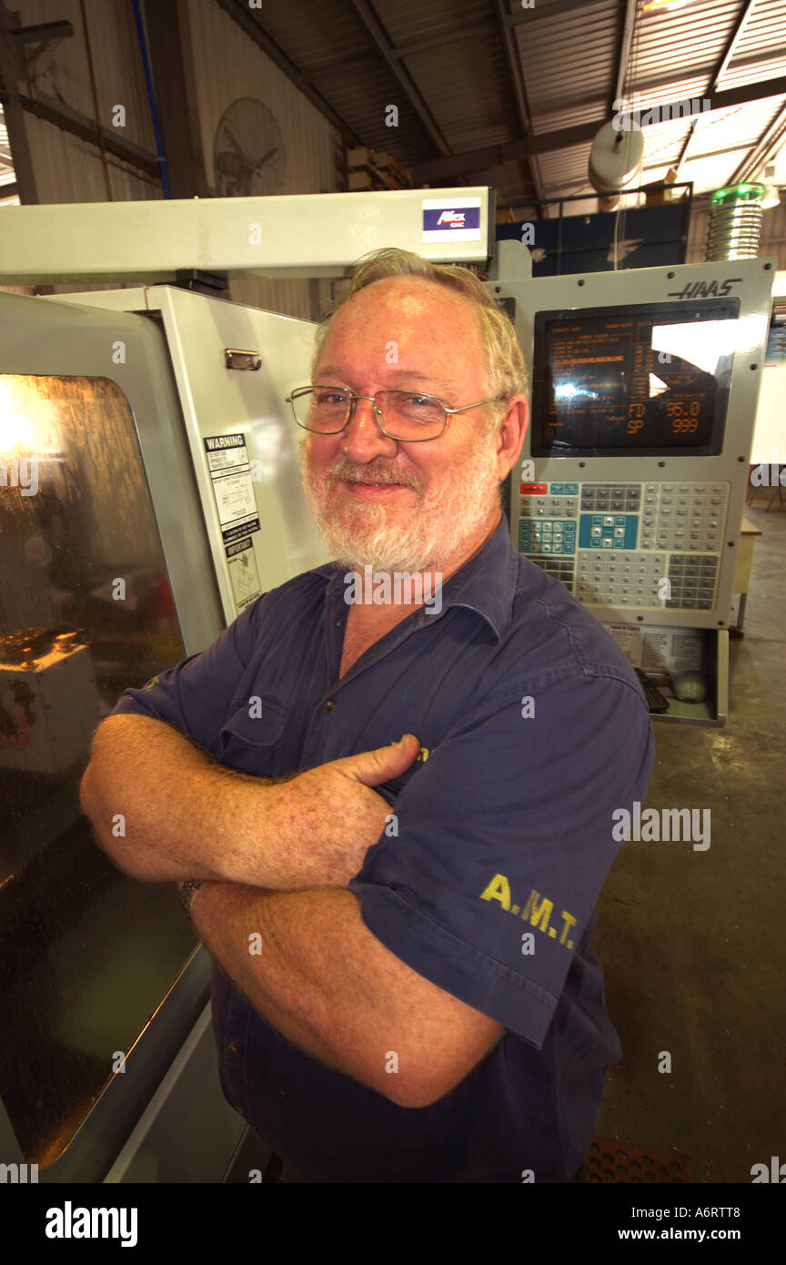 mature worker in metal workshop Stock Photo