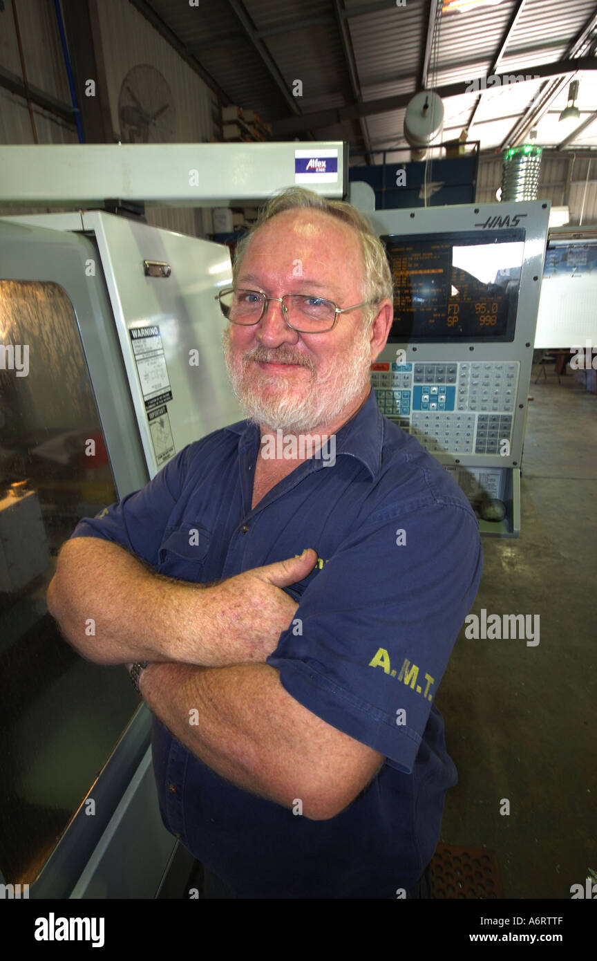 mature worker in metal workshop Stock Photo