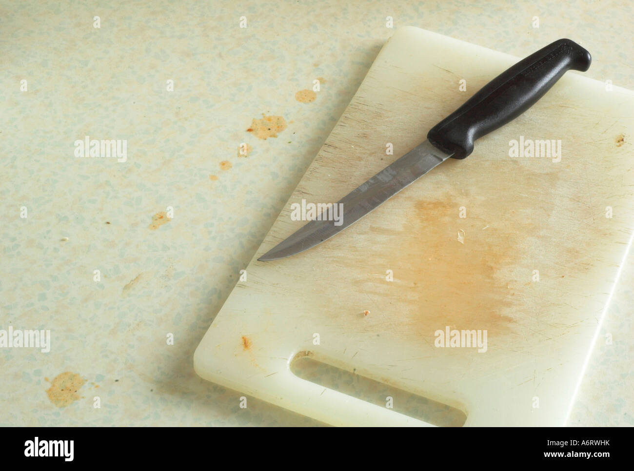 Dirty kitchen chopping board and knife Stock Photo Alamy