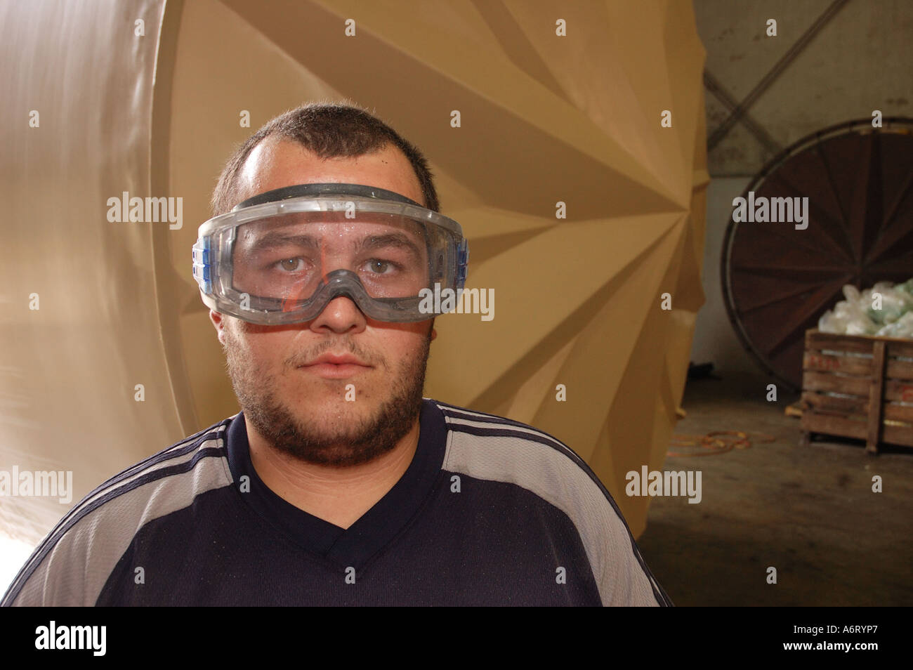 Factory worker wearing high impact safety goggles glasses Stock Photo
