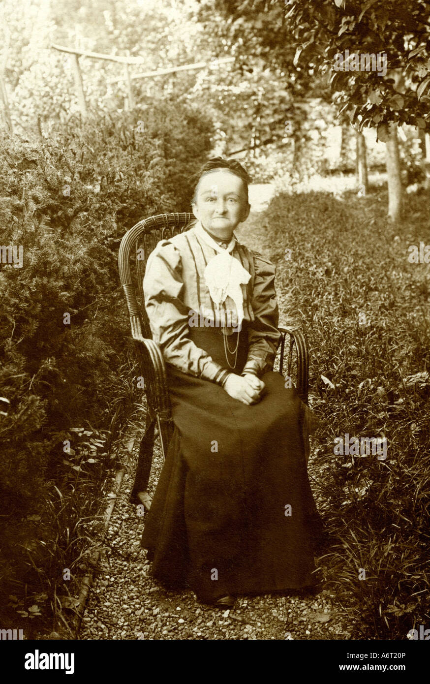 Old woman sitting chair full length hi-res stock photography and images ...