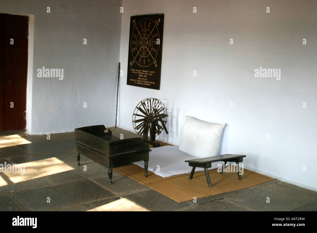 Mahatma Gandhi's spinning wheel and working space within the Sabarmati Ashram in Ahmadabad Gujarat India Stock Photo