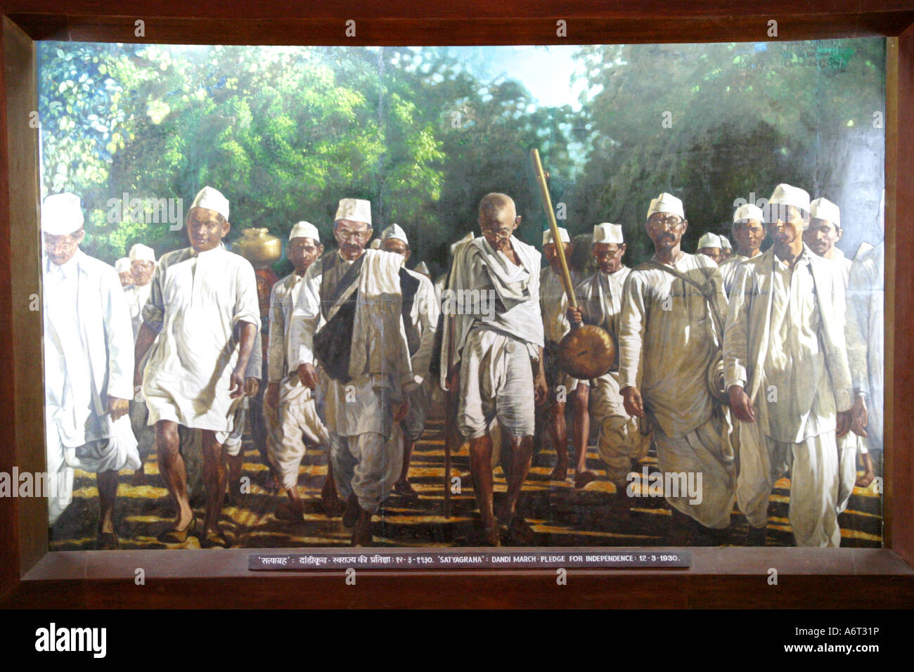 Painting of Mahatma Gandhi on the long salt walk protest ,'Dandi March',at the   Gandhi Ashram Ahmadabad Gujarat India Stock Photo