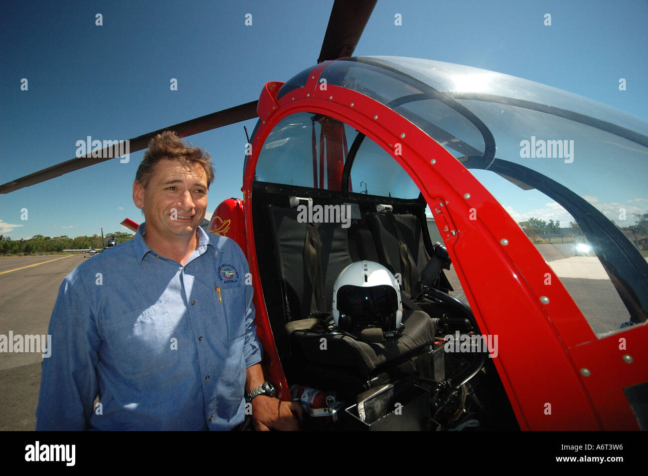 chopper pilot performing pre flight checks Stock Photo