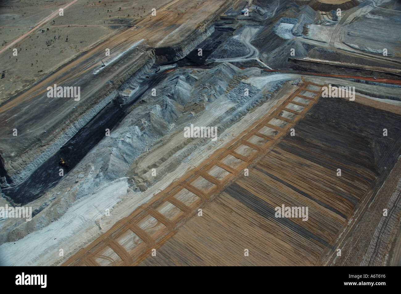 open cut coal mine showing native flora regeneration area on left Stock ...