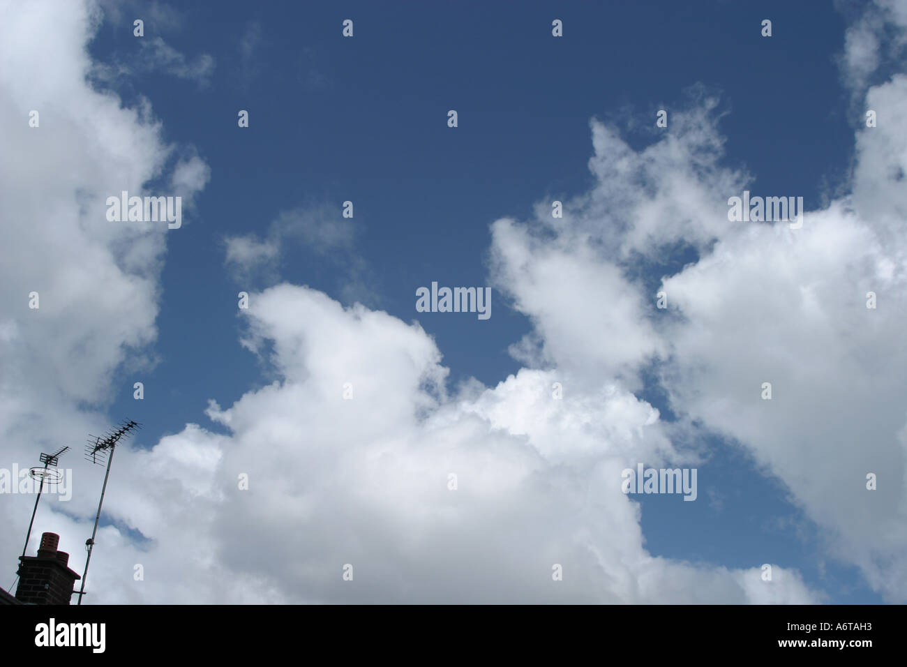 Blue sky and white fluffy clouds Stock Photo - Alamy