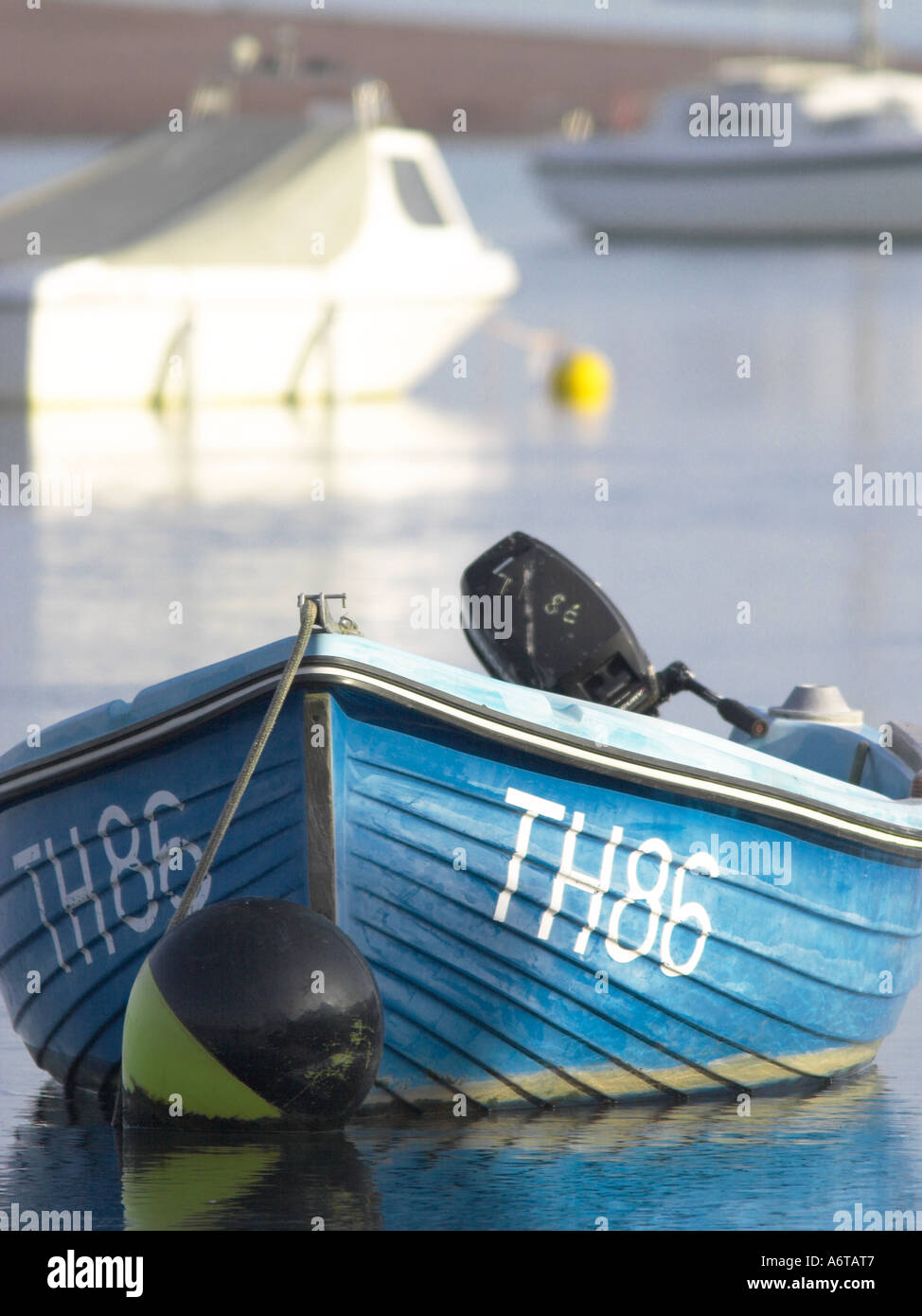A small blue boat at anchor Stock Photo