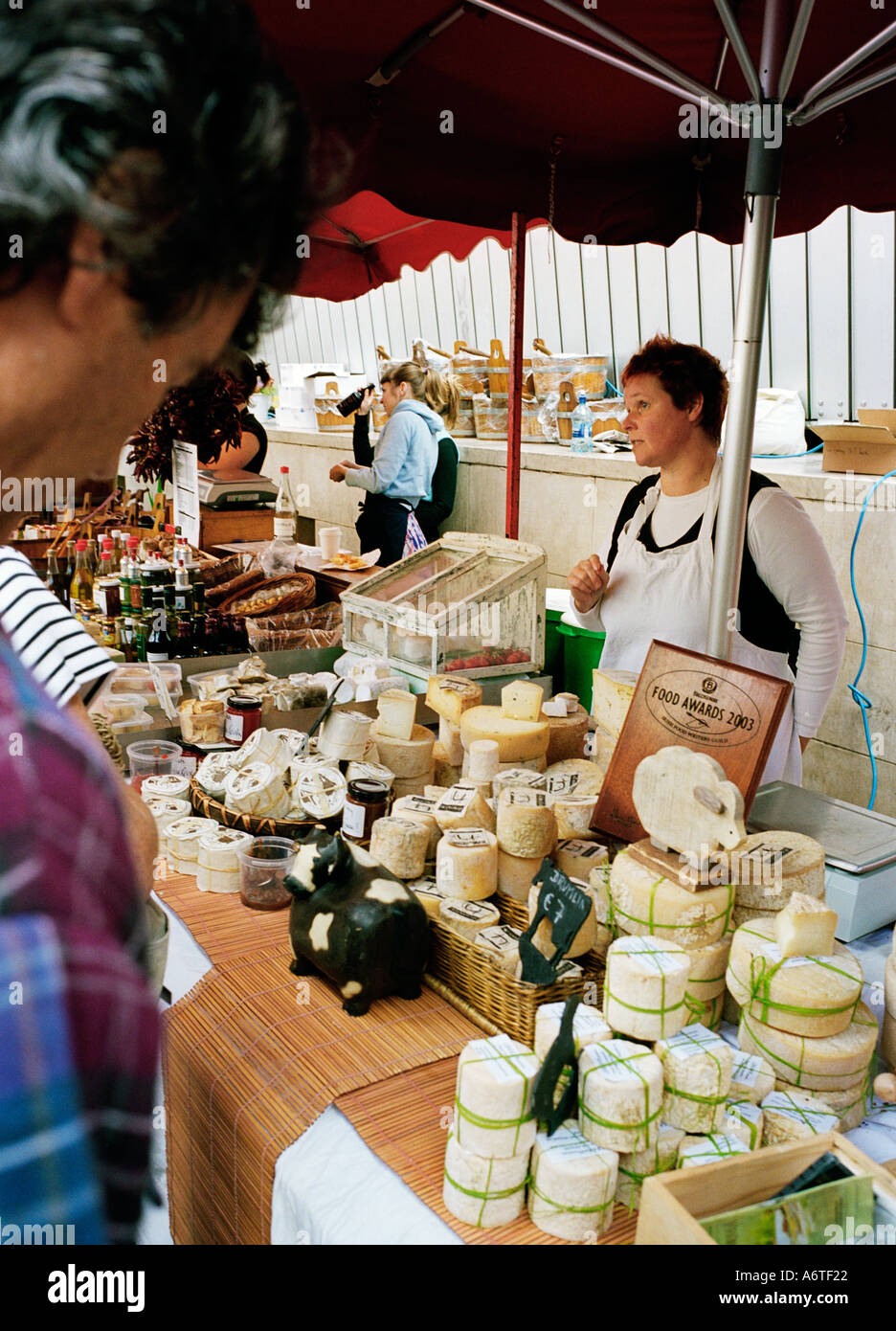 Organic fruits vegetables cheeses breads and other foods at the Temple Bar Saturday morning market - Dublin Ireland Stock Photo