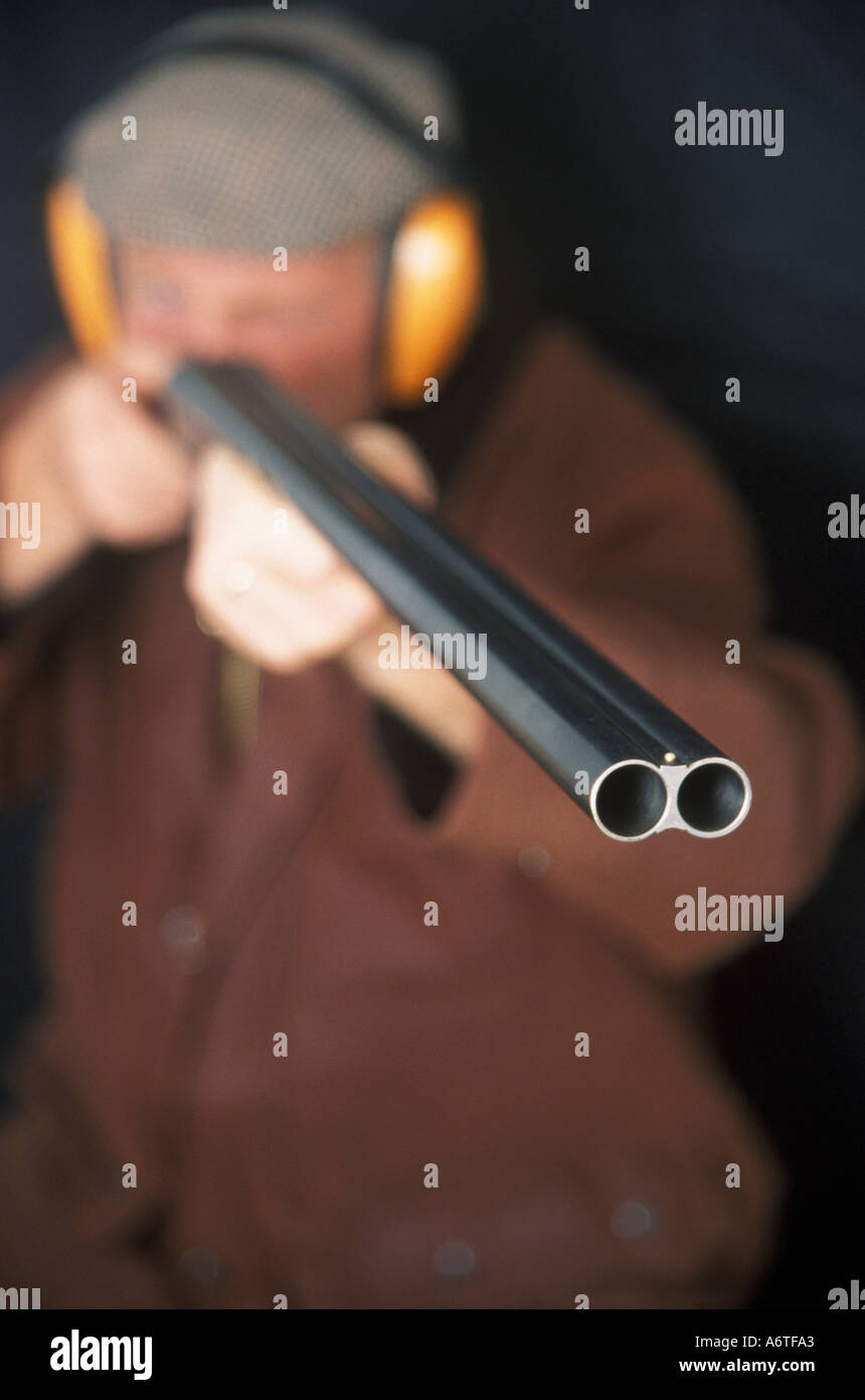 Man aiming a Double Barrel Shotgun Stock Photo Alamy