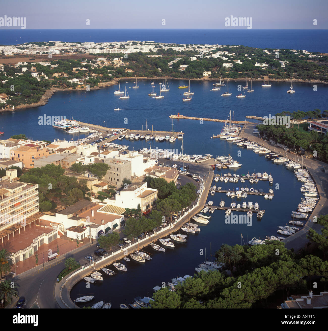 Aerial view looking East over the marina, small harbourand bay of Porto Petro near Cala D'Or, Santanyi, East Coast Mallorca, Bal Stock Photo