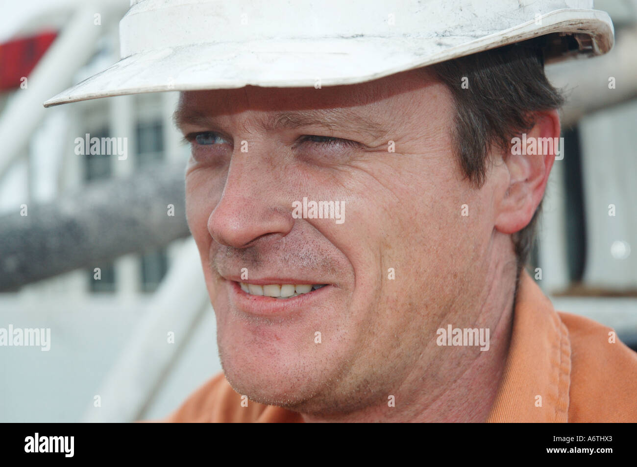Mine engineer worker leaning on his vehicle Stock Photo