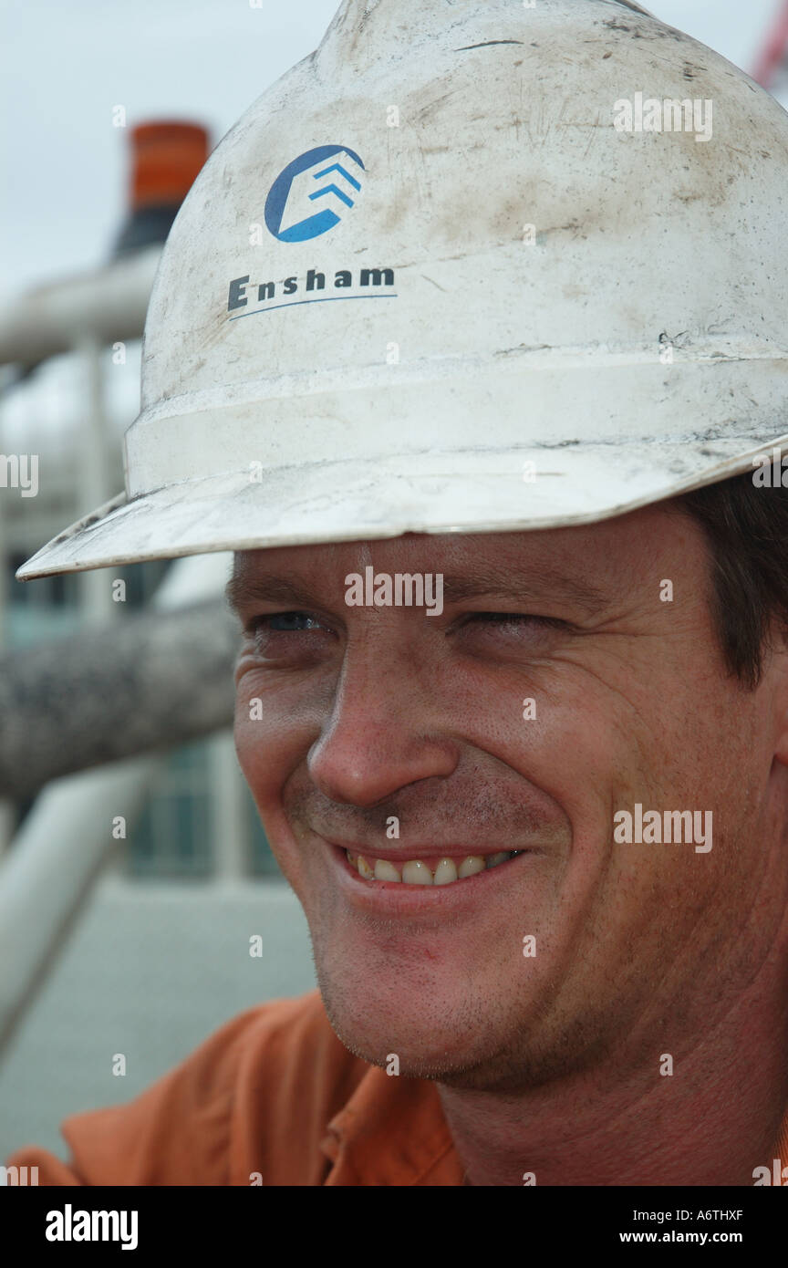 Mine engineer worker leaning on his vehicle Stock Photo