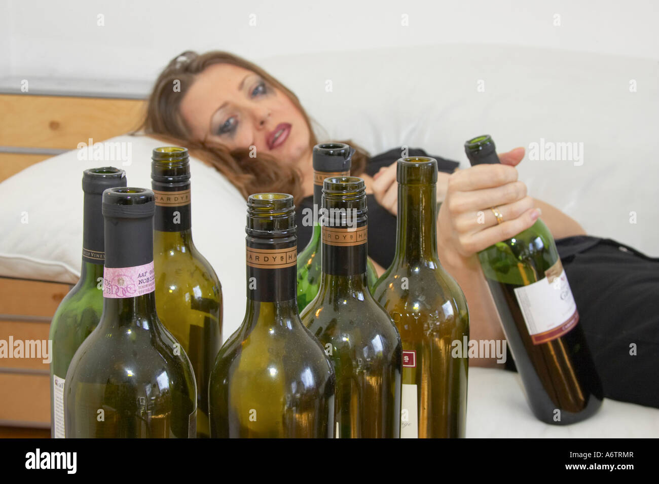 Woman Lying Down On Couch Drunk Stock Photo Alamy