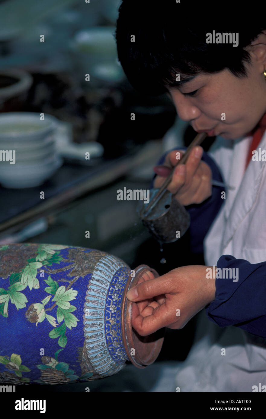 China, Beijing. Beijing Enamal Factory. Enamel process in Cloisonne manufacturing Stock Photo