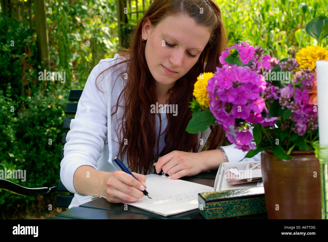 Young woman writing a letter with a fountain pen Young woman writing a letter with a fountain pen Stock Photo ...