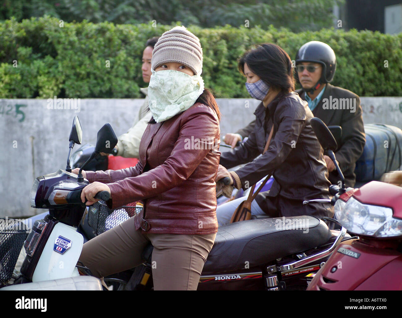 Girl on motorbike caught in traffic in Hanoi rush hour Vietnam Stock ...