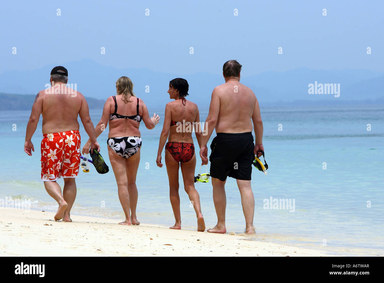 Tourists walking on the sandy beach of the island Koh Kradan - Andaman Sea , Thailand, Asia Stock Photo