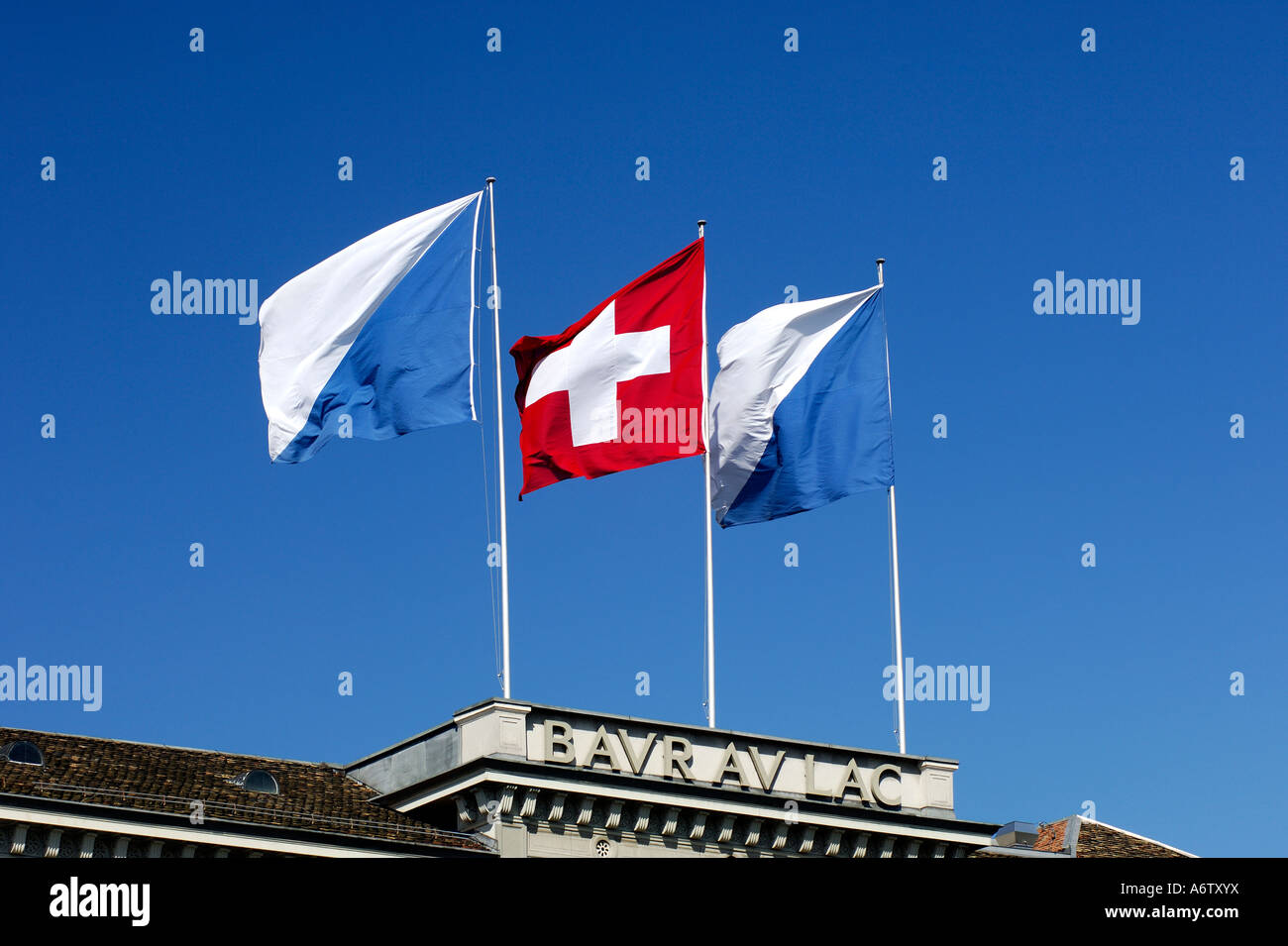 Flags of Switzerland and the Canton Zurich on the roof of the luxury hotel Baur au Lac, Zurich, Switzerland Stock Photo