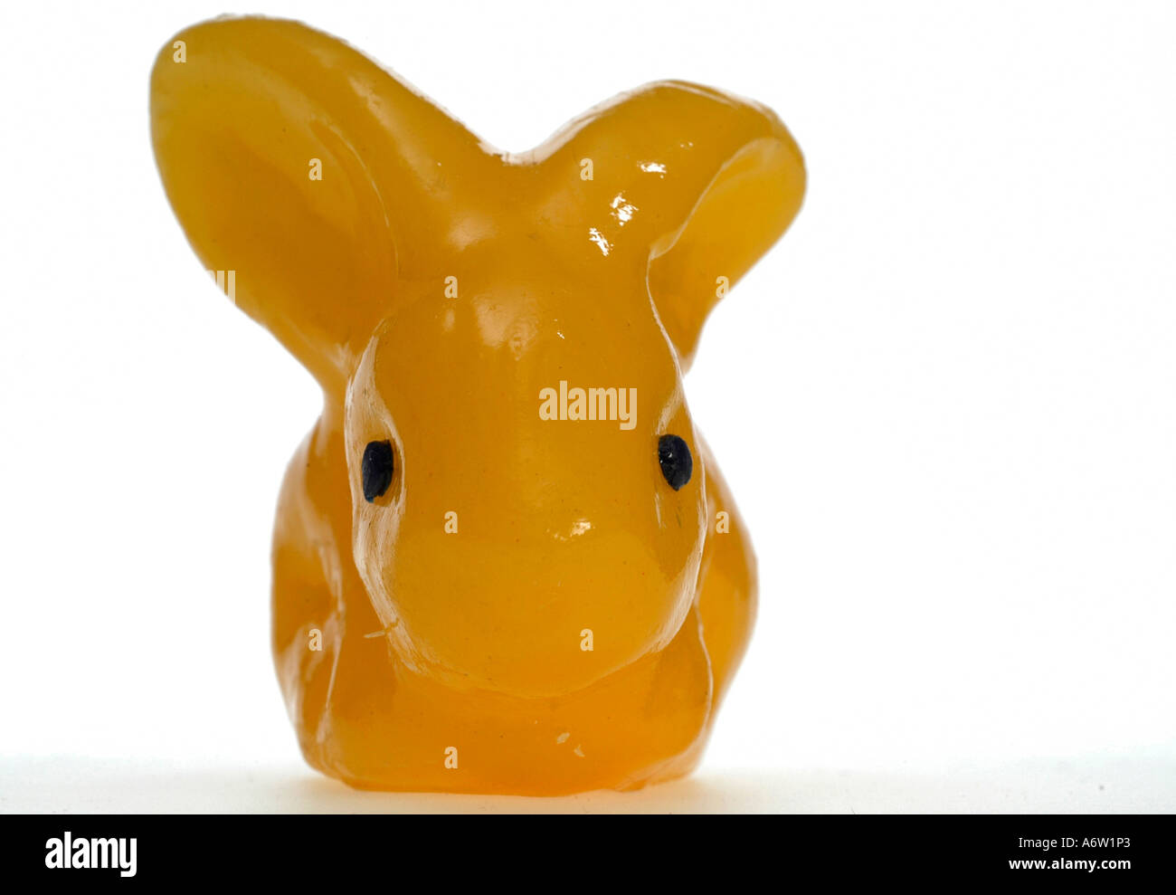 yellow Easter candle, bunny Stock Photo