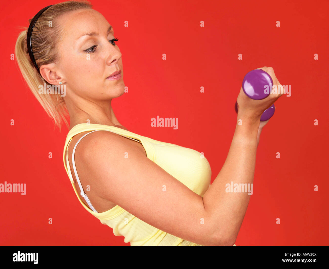 Young Woman Lifting Weights Model Released Stock Photo - Alamy