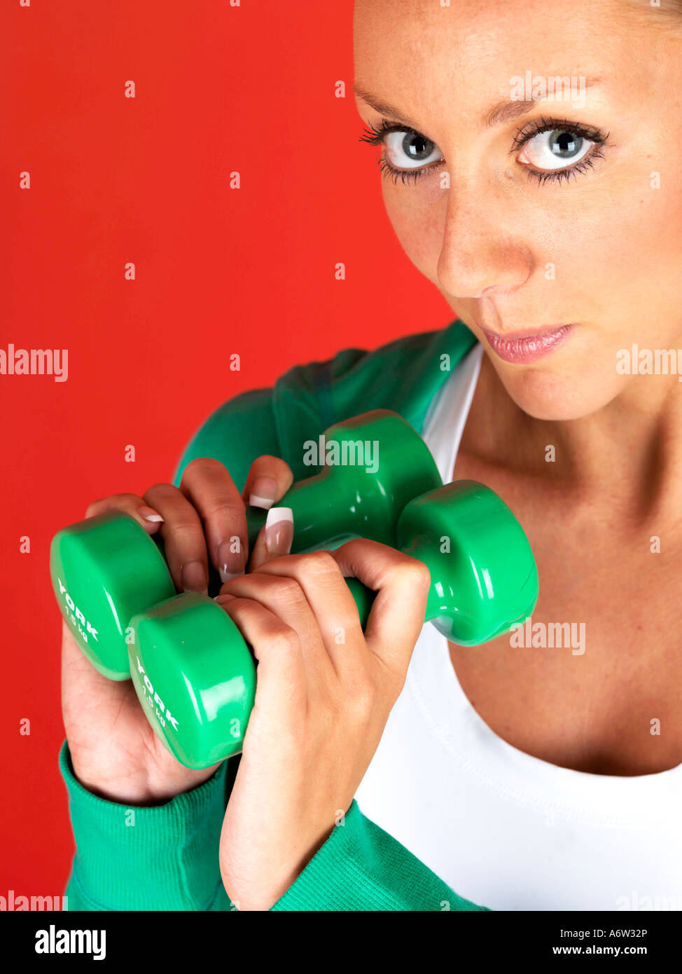 Young Woman Lifting Weights Model Released Stock Photo - Alamy