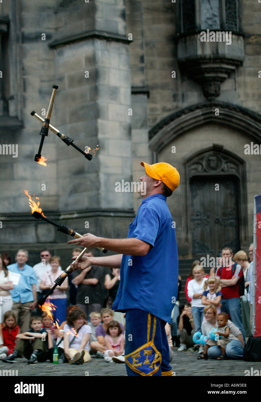 Street Performer juggling fire torches at the Edinburgh Fringe Festival Scotland UK Stock Photo