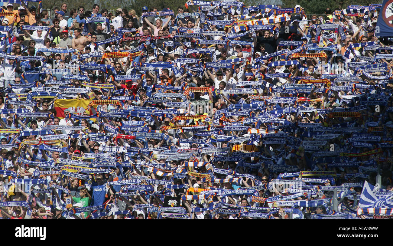 Fans of Karlsruher SC cheer for their club in the Wildparkstadium. Karlsruhe, Baden-Wuerttemberg, Germany Stock Photo