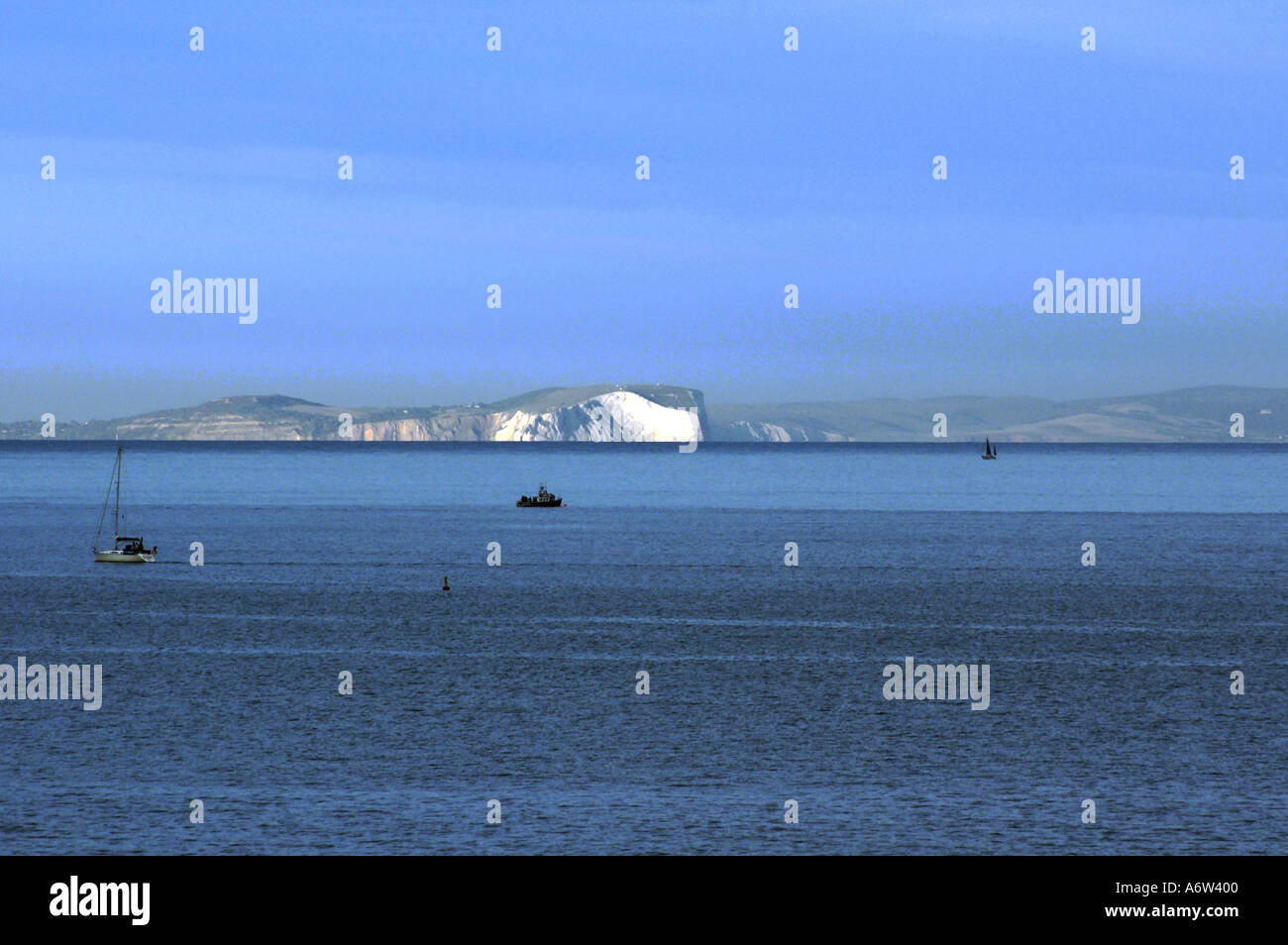 Needles and white cliffs on Isle of Wight picked out in evening sun Stock Photo