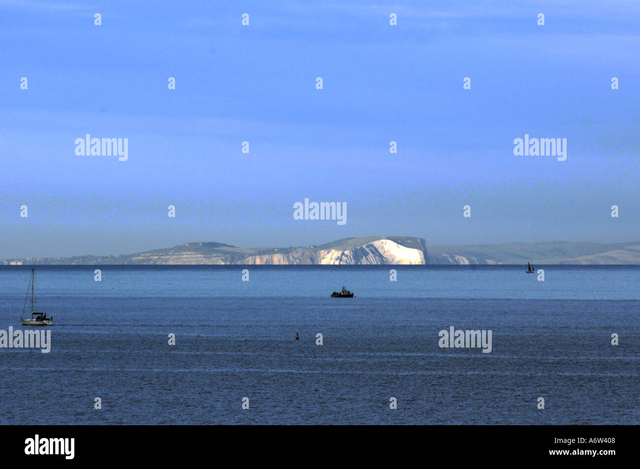 Needles and white cliffs on Isle of Wight picked out in evening sun Stock Photo