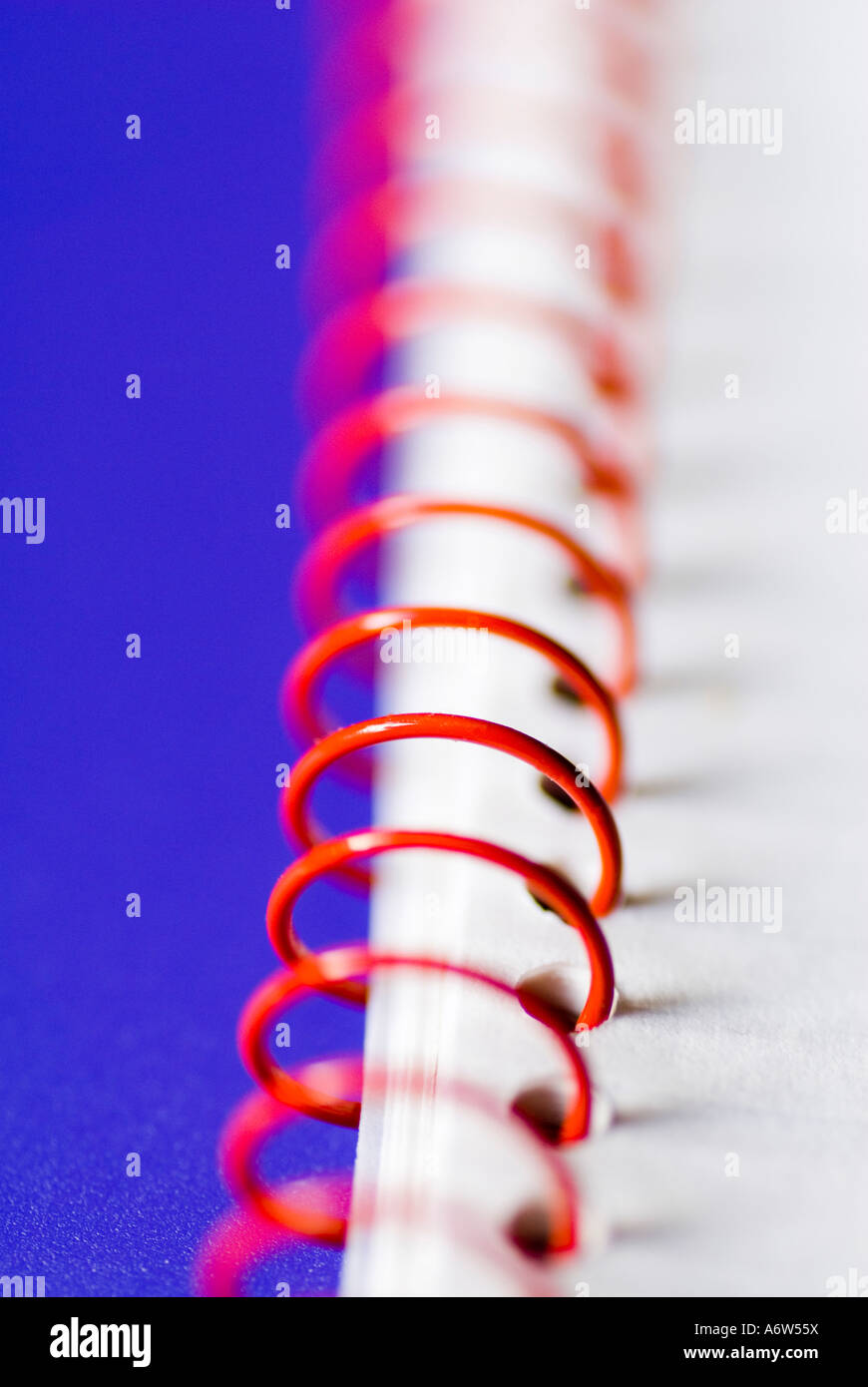 Close up of a ring wire bind book on a blue background Stock Photo