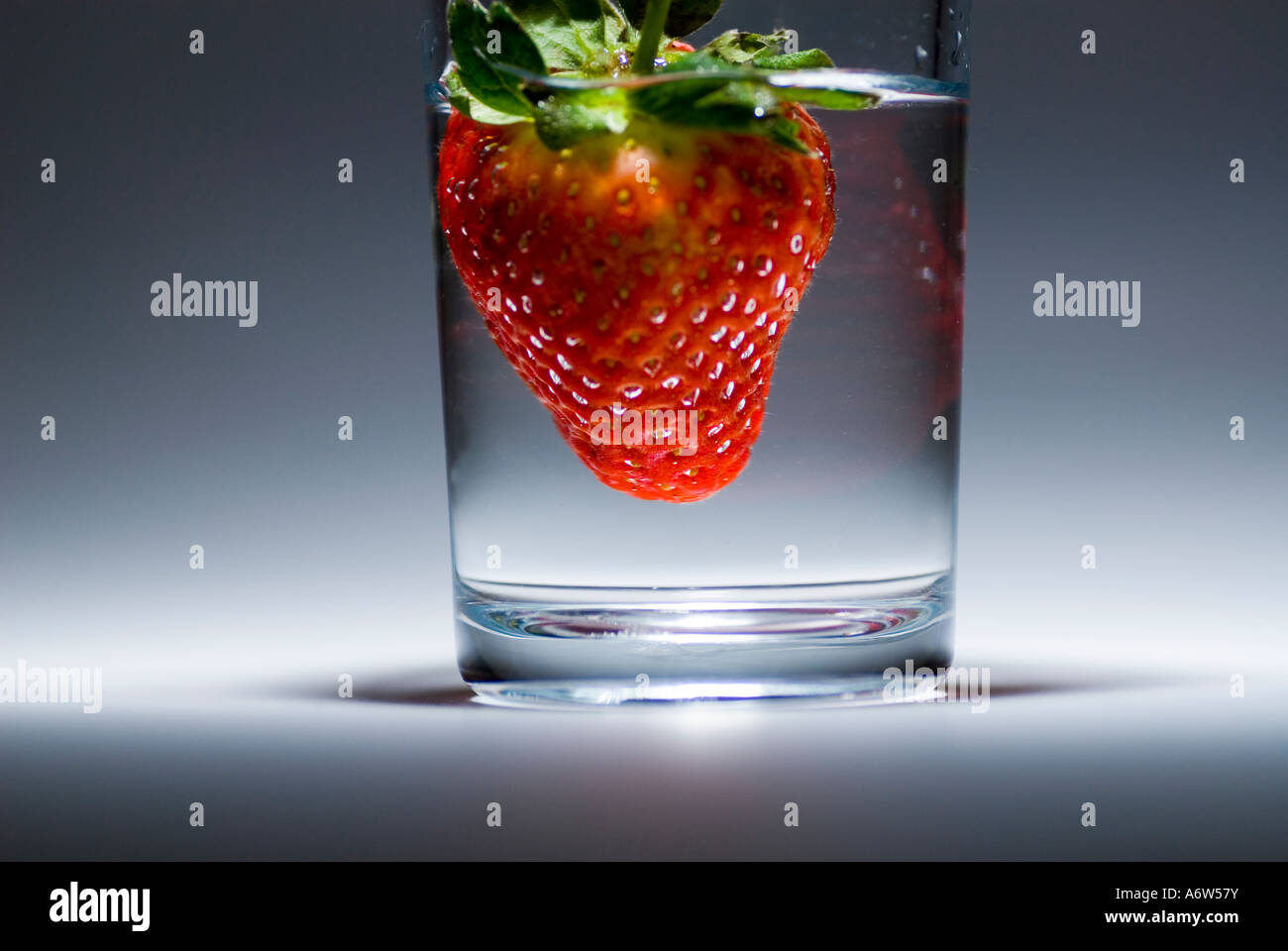 Strawberry in a glass of water Stock Photo - Alamy