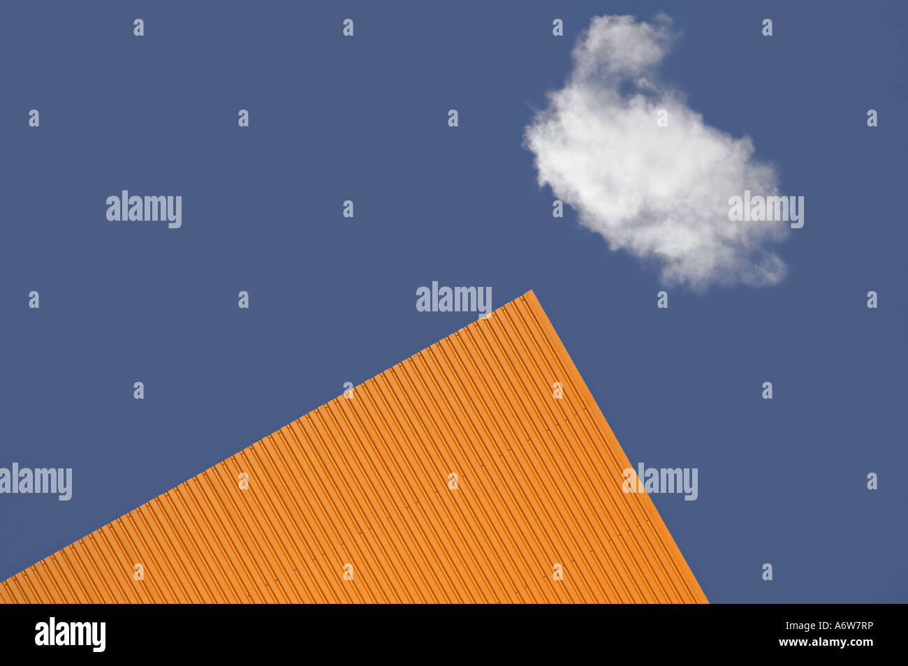 Orange house corner with cloud Stock Photo