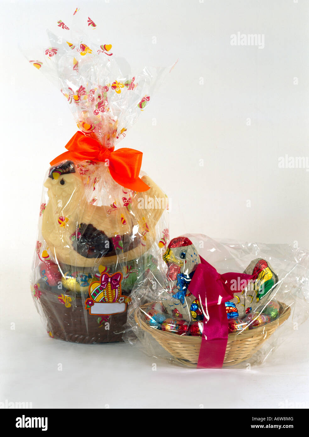 Easter Eggs & Chocolate Hens In Baskets Wrapped In Plastic Stock Photo