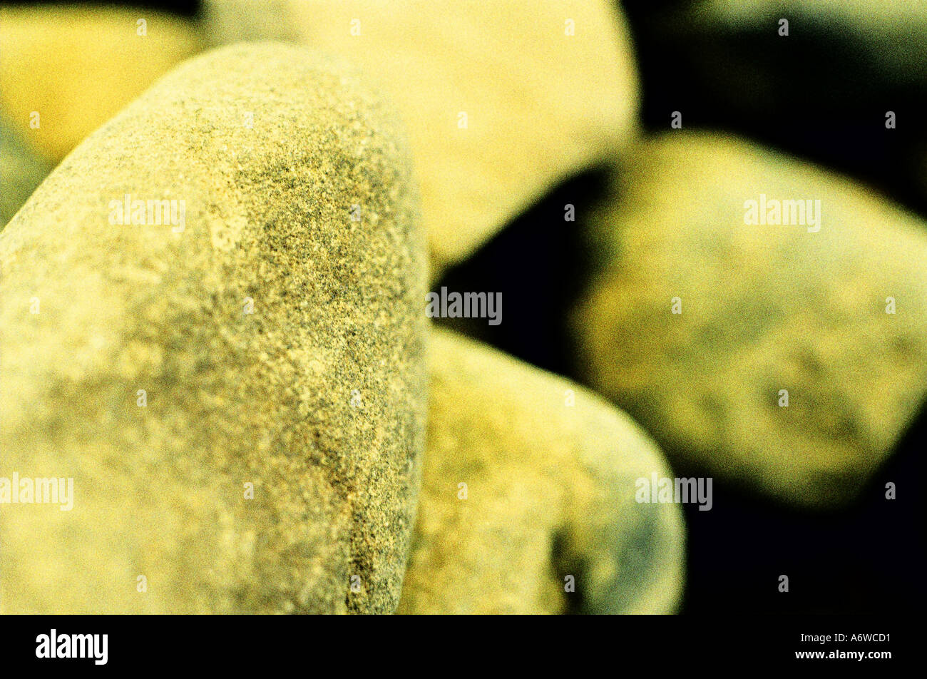 Pile of rocks with yellow cast Stock Photo - Alamy