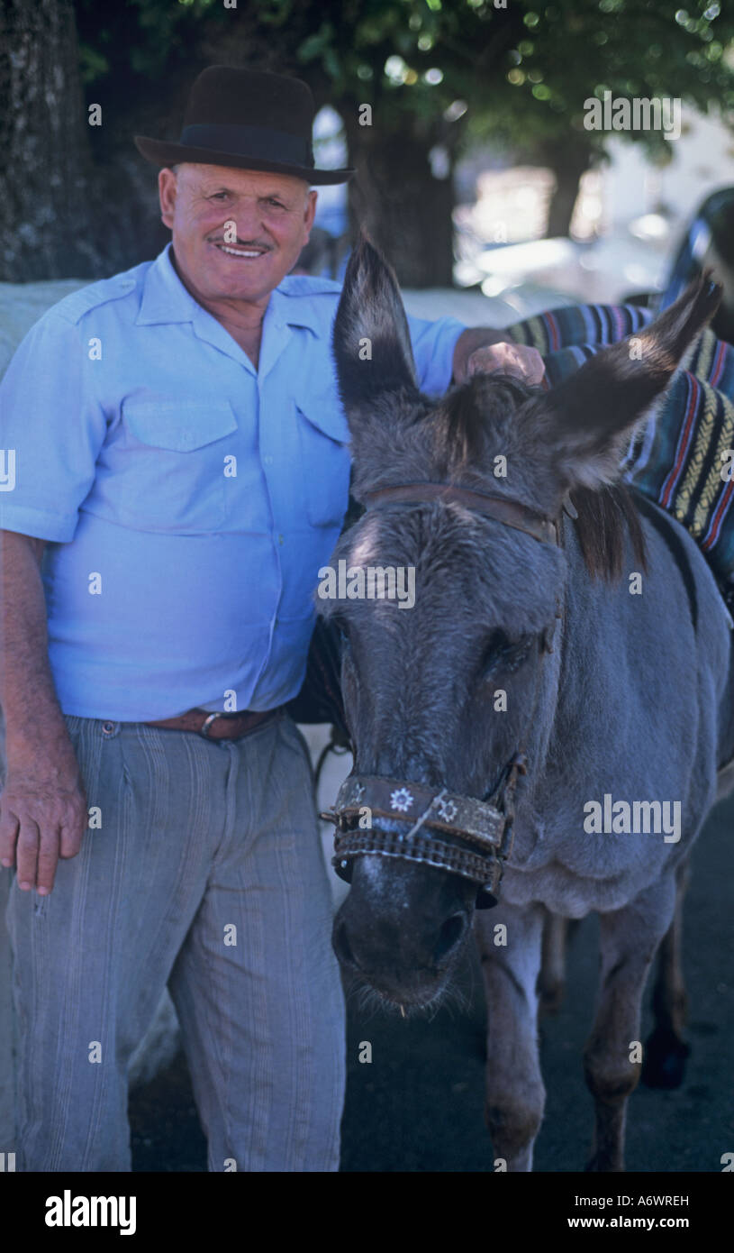 Gran Canaria, Spain. Cruz de Tejada, Man and Donkey Stock Photo