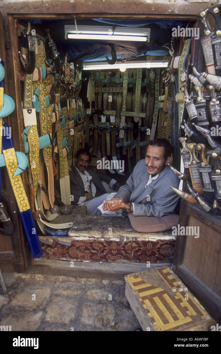 Yemen, Sana'a, Two men enjoy Qat chewing in their Jambiya (dagger) shop in the old city Stock Photo