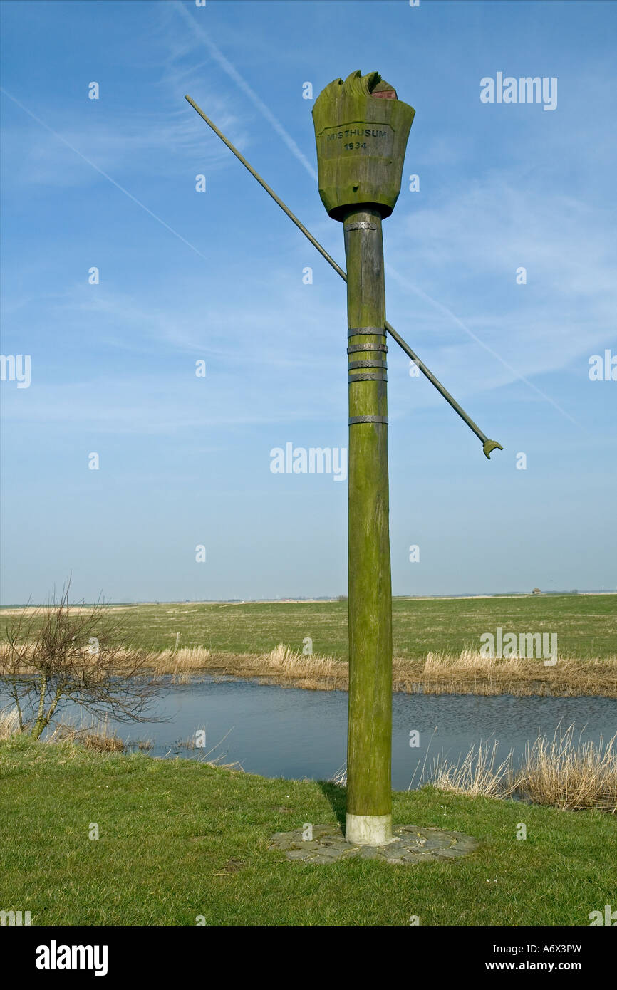 Flood Pole in the marsh land near Tønder Ballum Ene Denmark Stock Photo