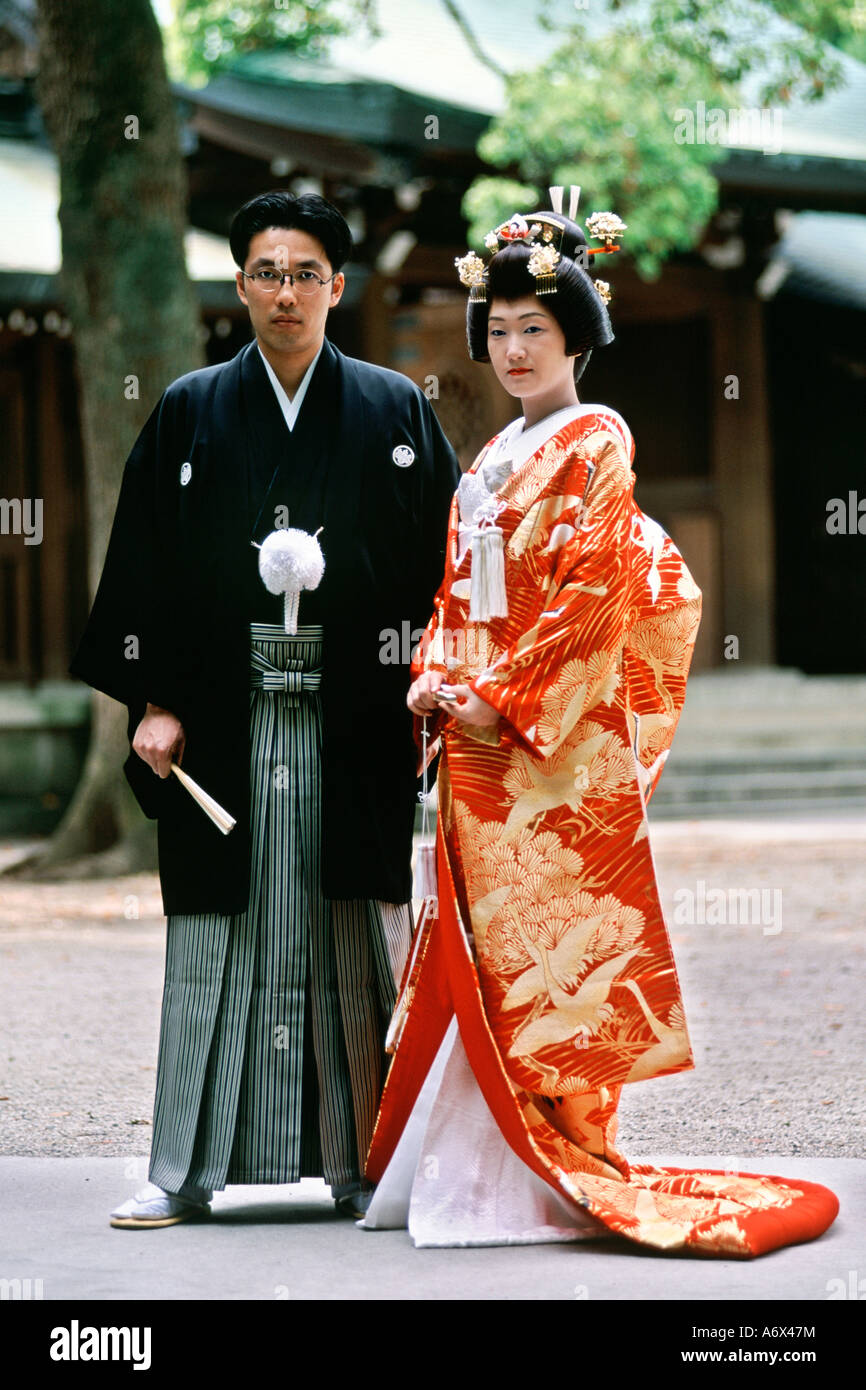 A Japanese Couple Pose For Photos After Their Traditional