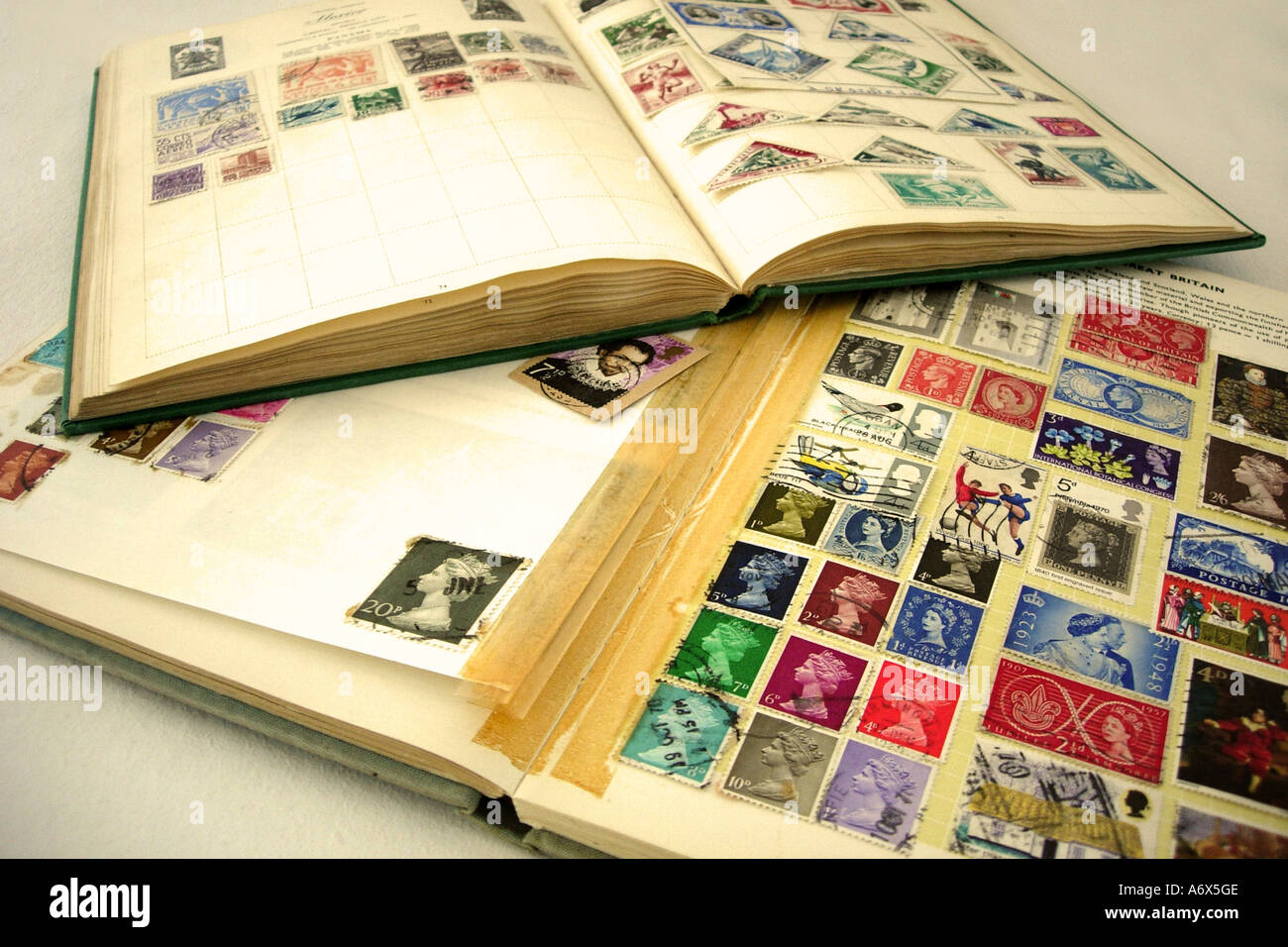 An open stamp album displaying a stamp collection Stock Photo